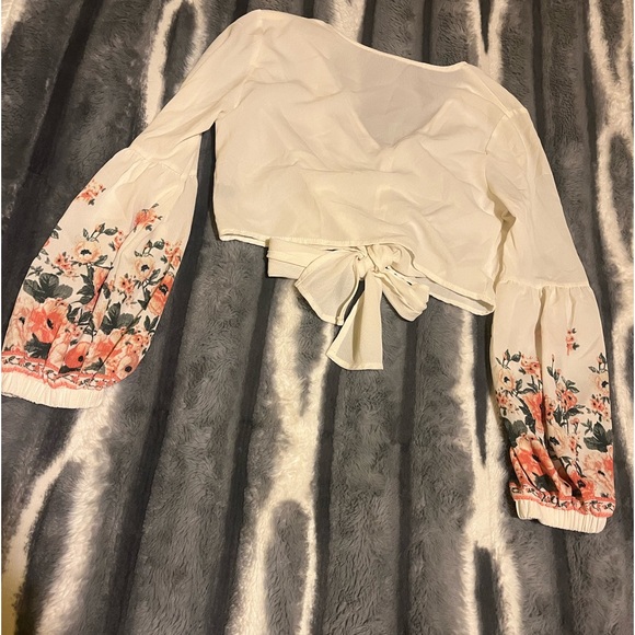 This is a sheer floral puff sleeve top. - Picture 3 of 3
